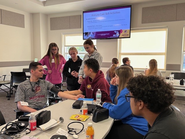 Health Career Pipeline Program students learning to take blood pressure