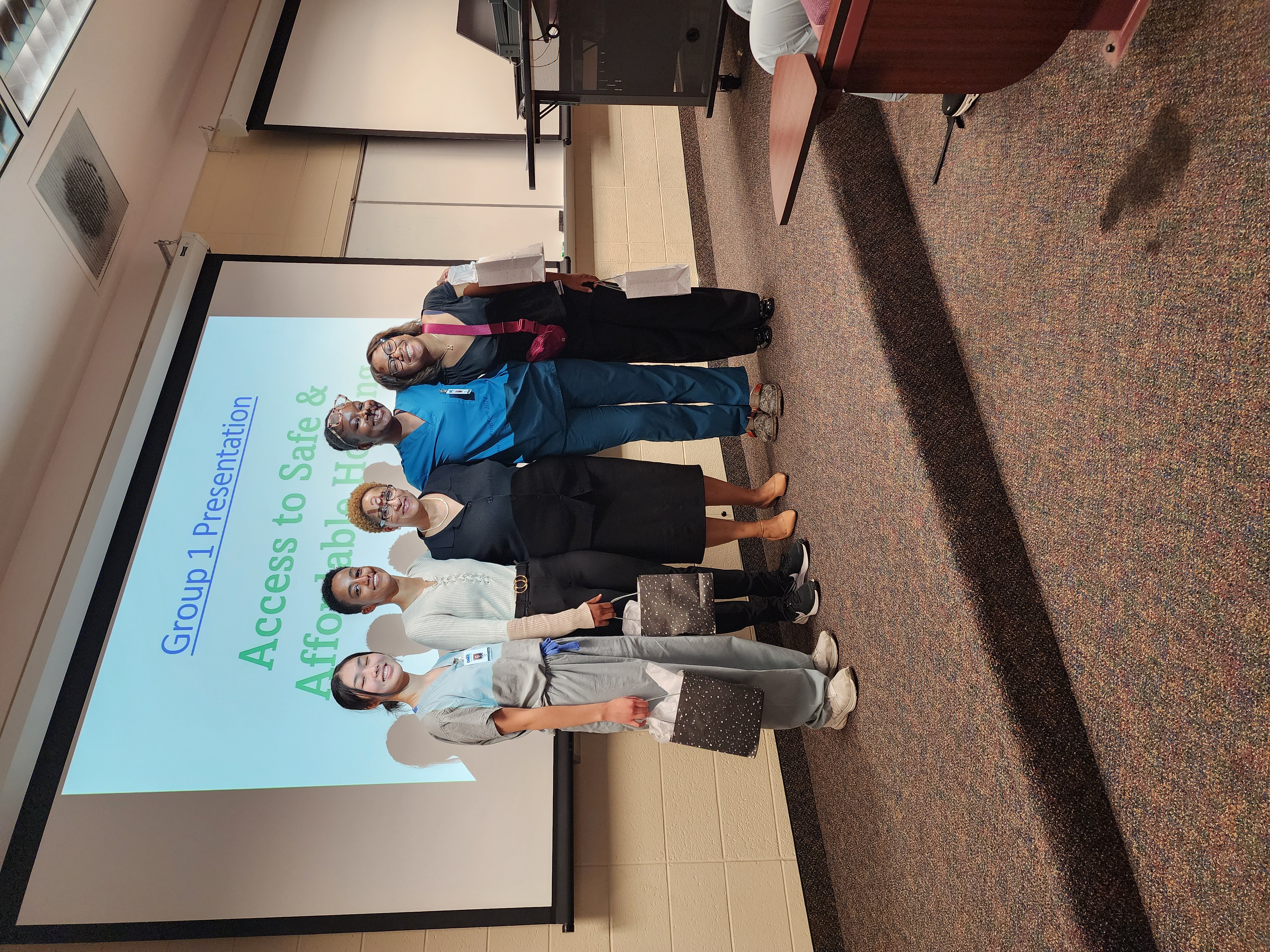 A group of Medical Mentors Pathway Programs Students taking a group photo during a presentation