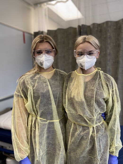 Two students wearing PPE